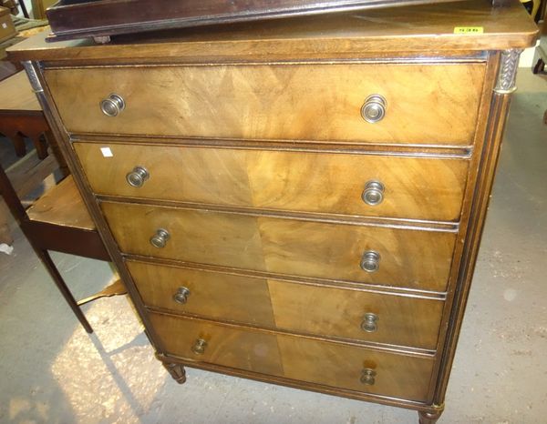 A pair of 20th century walnut five drawer chests.