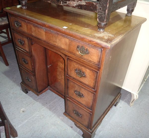 A 20th century mahogany kneehole dressing table.