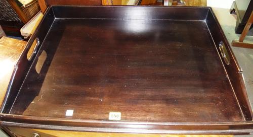 A 20th century ebonised butlers tray and folding stand.