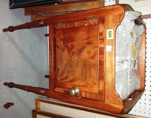 An early 19th century mahogany galleried single door night stand.