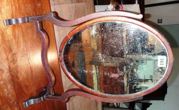 A 19th century mahogany oval toilet mirror and a painted pine lift top trunk.