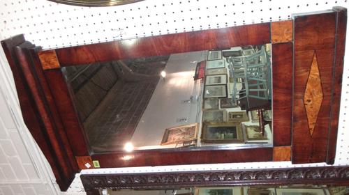 A 19th century mahogany and burr walnut hall mirror with arched pediment.