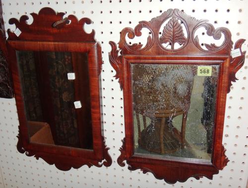 A 19th century mahogany fret cut pier mirror and another with carved decoration.