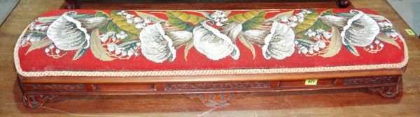 A 19th century carved walnut long footstool with bead work upholstery, together with another walnut stool.