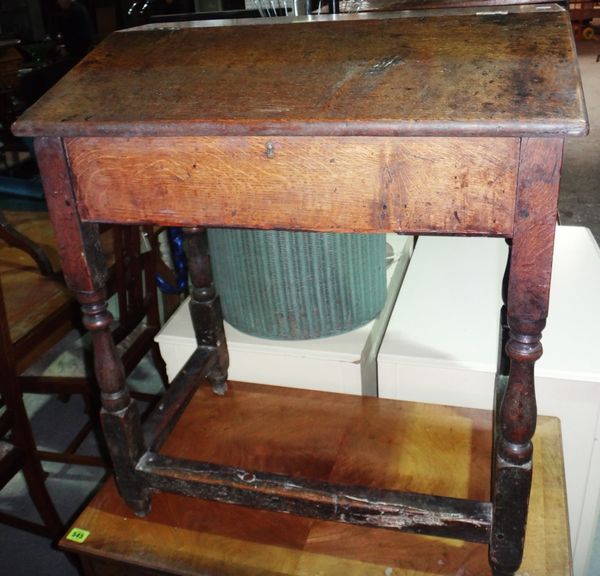A 19th century oak slope front writing desk, together with an oak joint stool.