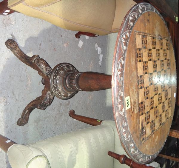A Victorian walnut and mahogany tripod table with a chessboard top, a mahogany wine table and a coal scuttle.
