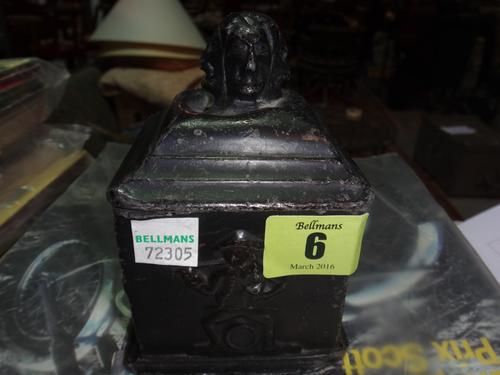 An early 19th century painted lead tobacco box and cover with figural decoration.