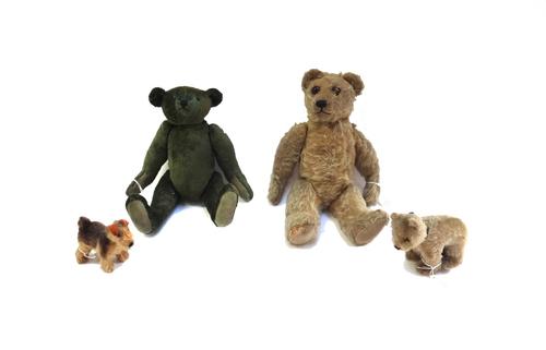 A Steiff style green teddy bear, with boot button eyes and jointed limbs, 33cm, together with another vintage teddy bear with gold plush fur, a small