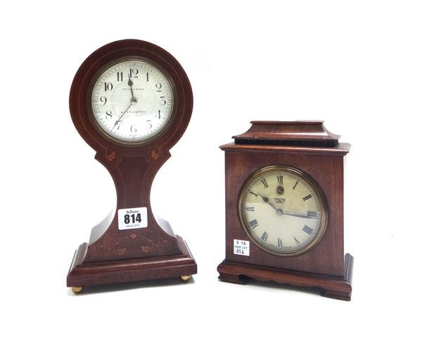 An Edwardian mahogany and inlaid balloon shaped mantel clock, the white enamel dial detailed 'Knight and Son, Northampton', with a pinched waist and p