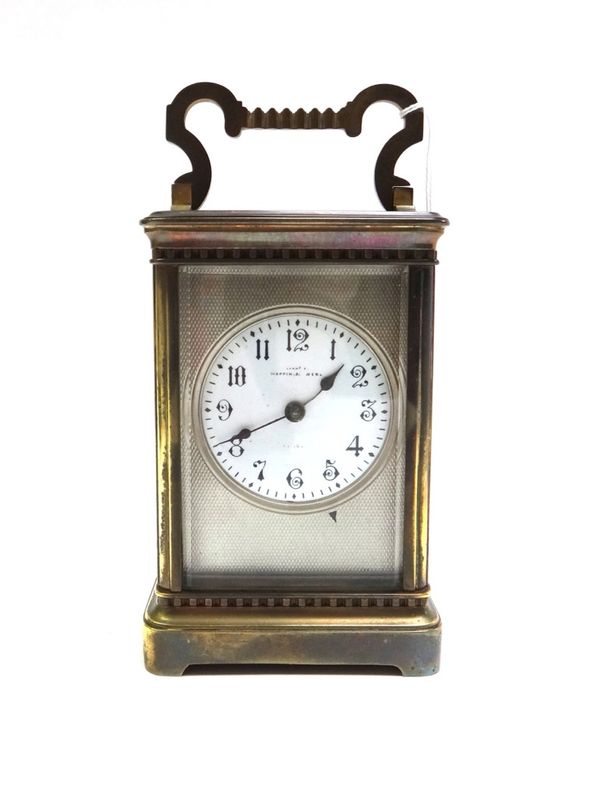 A gilt brass cased carriage clock, early 20th century, the white enamel dial detailed Mappin & Webb, with two train movement, 14cm high (two keys and
