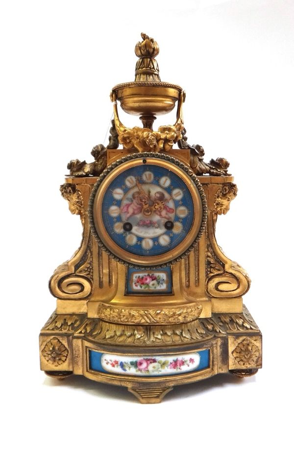 A French gilt bronze and porcelain clock, circa 1880, the porcelain dial painted with cherubs and inscribed 'Lerolle Fres Paris' the bell strike movem