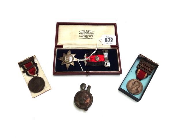 A Masonic silver medal, presentation engraved and dated 1923, two bronze George V Kings medals, three lighters, and military brass badges. (qty)
