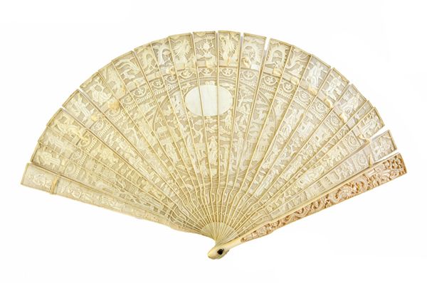 A Cantonese carved ivory fan, late 19th/early 20th century, the sticks pierced and carved with Oriental figures, with central roundel, 19cm.  Illustra