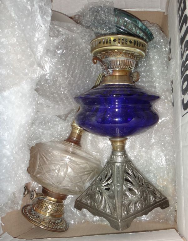 Two Victorian oil lamps and shades.