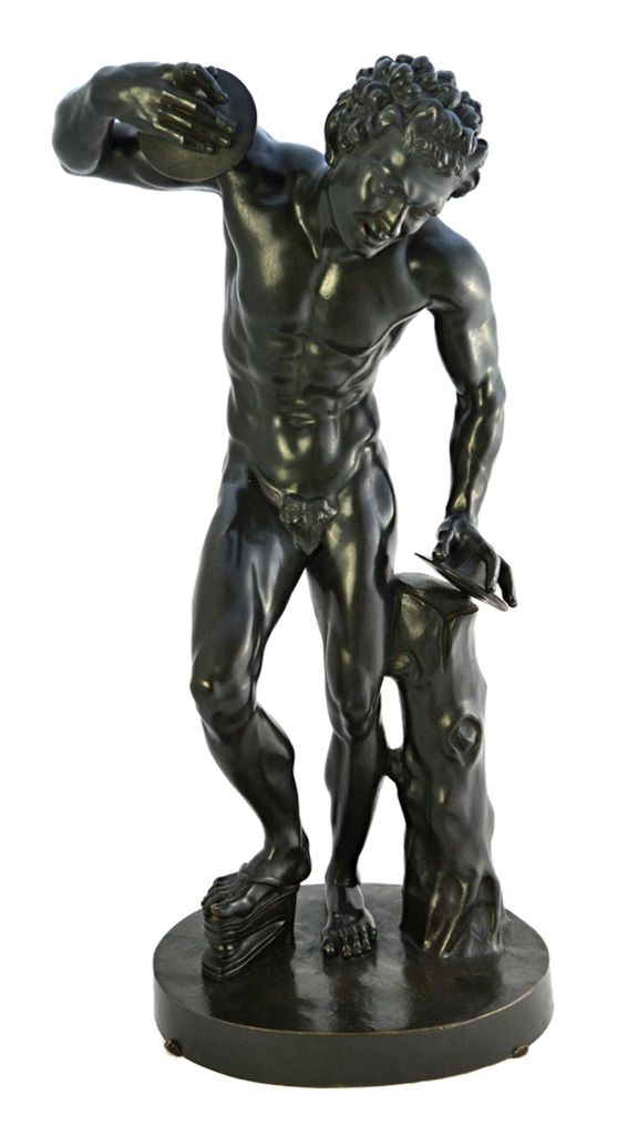 An Italian bronze figure of the Dancing Faun, late 19th century, after the antique, standing on an oval base, 56cm high.   Illustrated