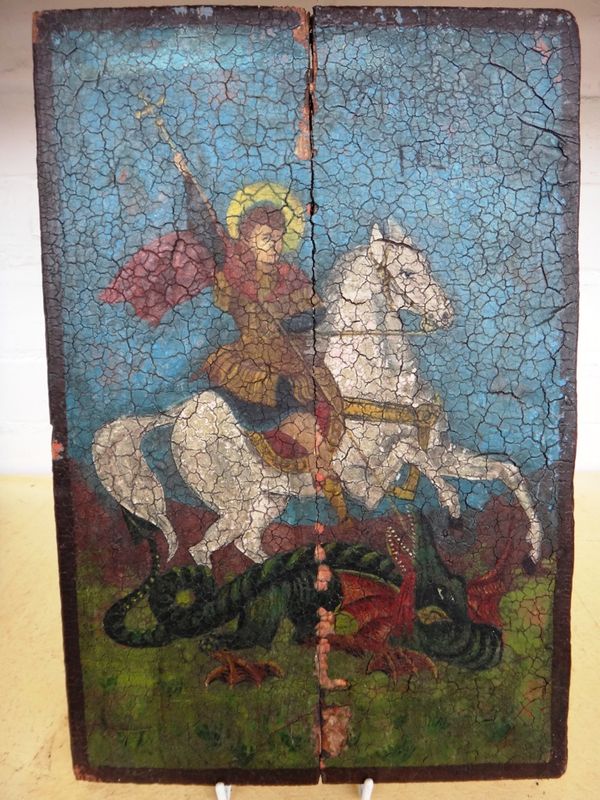 A Russian icon, late 19th century, depicting George and the Dragon, 36cm x 24cm.