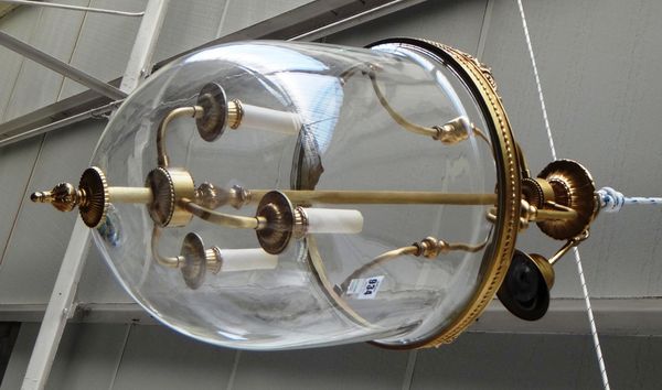 A gilt metal and glass hanging lantern of Regency style, modern, with internal three light hanging fitment, 81cm high x 37cm wide.