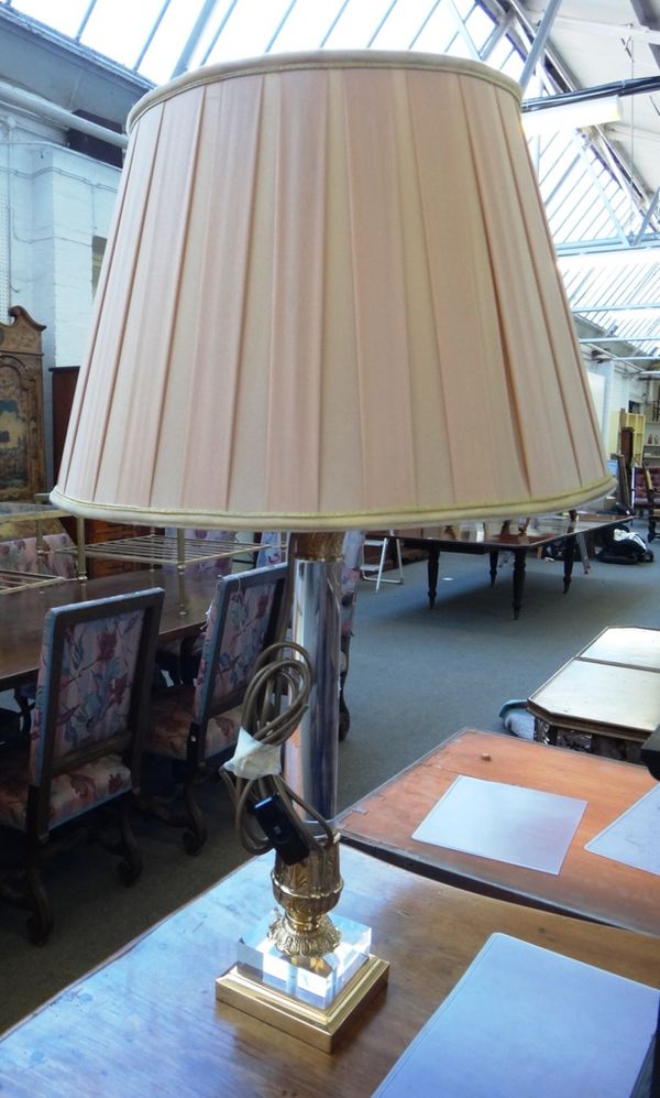 A pair of modern perspex and gilt metal mounted table lamps of corinthian column form, with pleated silk shades, 50cm high excluding shades. (2)