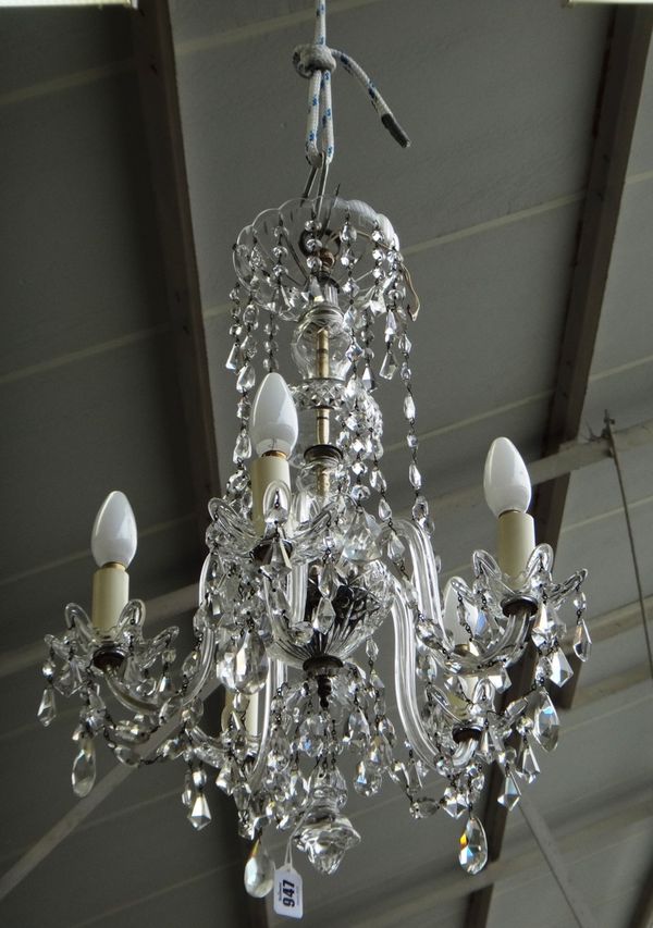 A cut glass five branch chandelier, 20th century, the baluster stem issuing five swan neck branches, restored all over with glass drops, 58cm high.