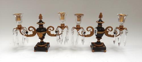 A pair of Regency gilt bronze and cut glass twin branch candelabra, 19th century, of urn form with foliate cast sconces and cut glass drops, 22cm high