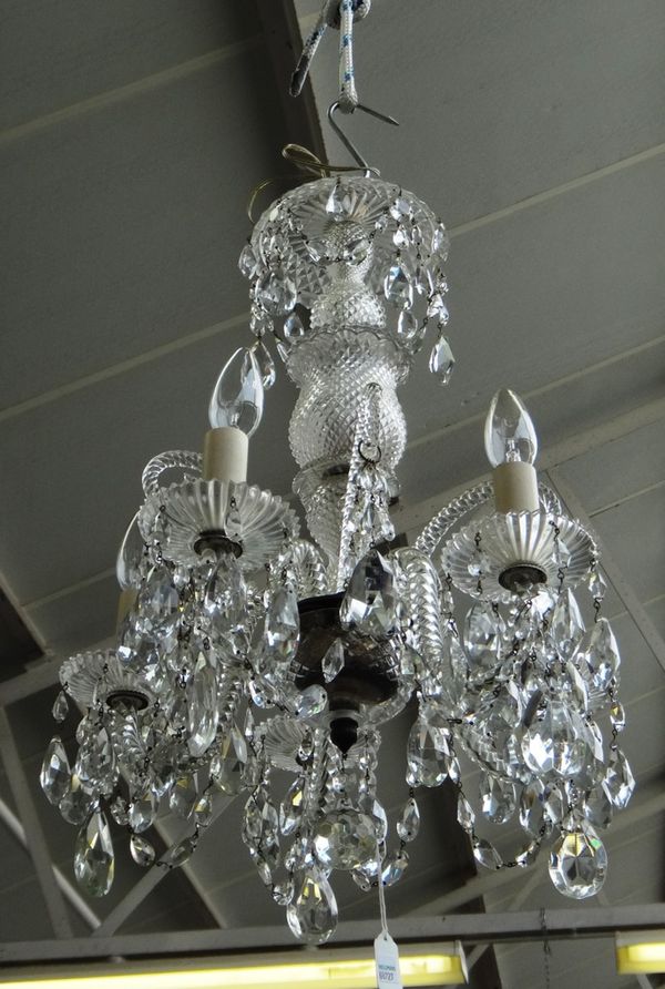 A cut glass five branch chandelier, 20th century, with hobnail cut baluster stem issuing five swan neck spiral twist branches united by cut glass chai
