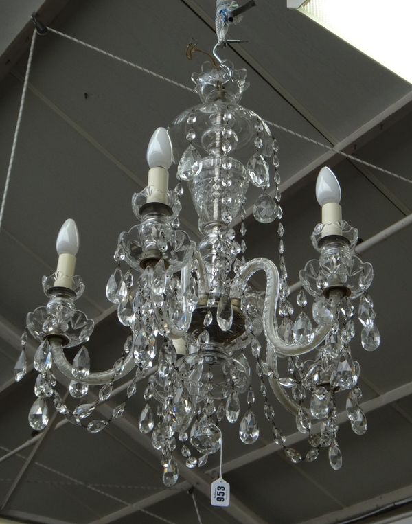 A cut glass five branch chandelier, 20th century, with a domed surmount over an urn moulded baluster stem issuing five thumbnail cut swan neck branche