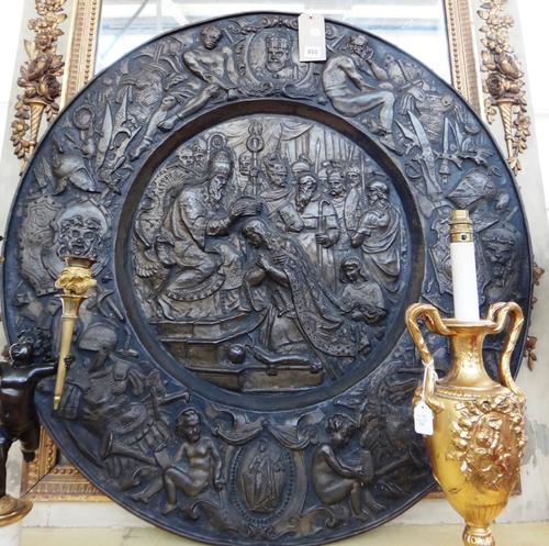 A pair of South European repousse brass pictorial roundels of Renaissance style, late 19th century, one depicting the coronation of Charles V as a Hol
