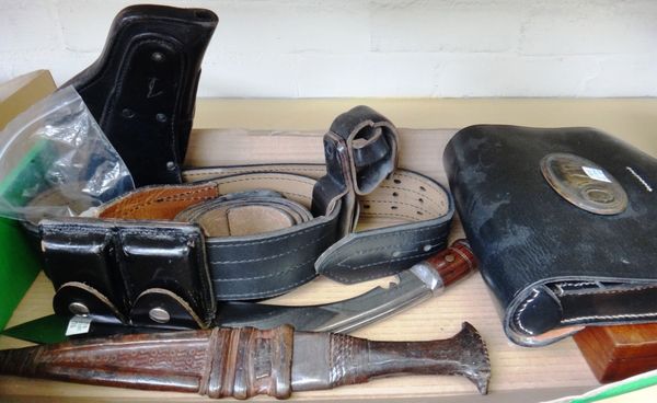 A black leather belt and holster, a leather ammunition case, a mahogany pistol case, a kukri an African dagger and a 'U.S' leather belt (6).