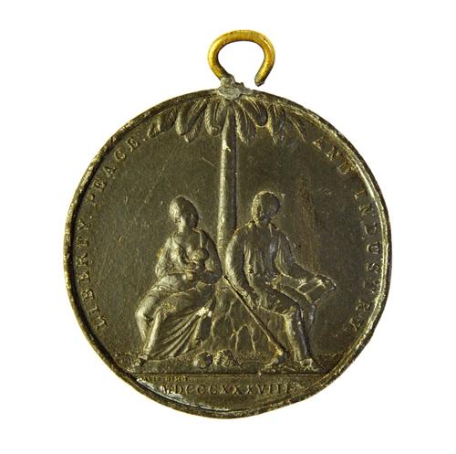 A commemorative medal for the abolition of negro apprenticeship in the West Indies, 1838 by Davis, of white metal, relief cast with a negro couple and