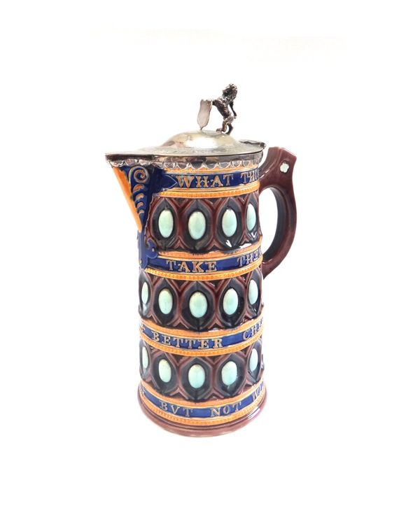 A Wedgwood majolica caterer jug, late 19th century, with silver plated hinged lid and lion finial, over a cylindrical body moulded with verse and band