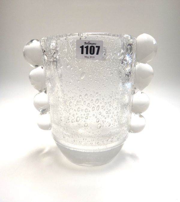 A Daum glass vase, circa 1930, with air bubble inclusions and shaped quadraform decoration to the sides, engraved 'Daum, Nancy France', 19cm high.