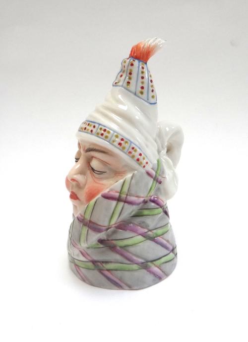 A Royal Worcester candle snuffer, 'Mr Caudle', date code 1894, puce printed mark, 8cm high.