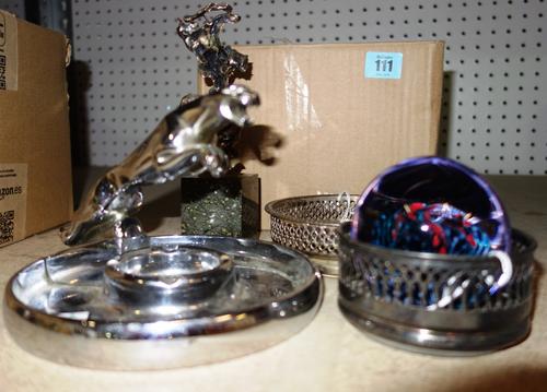 A circular chrome plated ashtray with a jaguar motorcar motif, a Caithness glass paperweight, a stone set sculpture, on a rectangular plinth, two plat