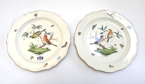 A pair of Wedgwood creamware plates, 19th century, each painted with two birds perched in branches, surrounded by insects, inside a shaped gilt-edged