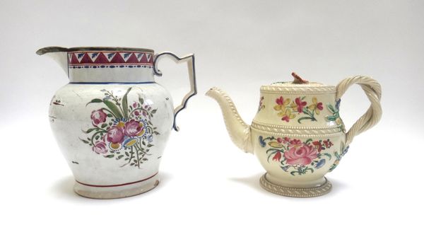 A creamware teapot and cover, circa 1775, with spiral twist handle and foliate decorated body, 12cm high (a.f), and a pearlware jug, circa 1810, folia