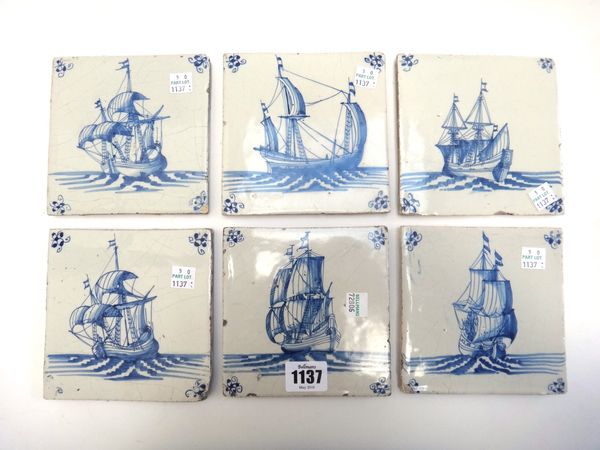 A set of six Dutch Delft blue and white tiles, 18th century, each painted with a sailing vessel inside `spider' corner motifs, 12.5cm wide.