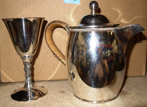 Silver plated wares, comprising; a pair of entree dishes and covers (lacking handles), eight goblets, a pair of Viners small match stands, a jug and a