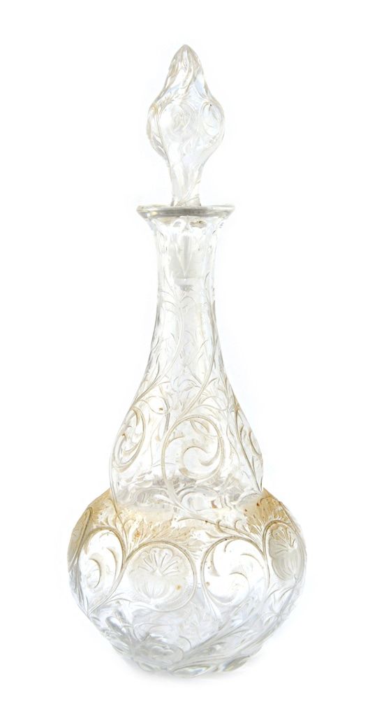 A 'rock crystal' glass decanter and stopper, circa 1890, possibly by Webb or Stevens & Williams, finely engraved with trailing flowers against a shape