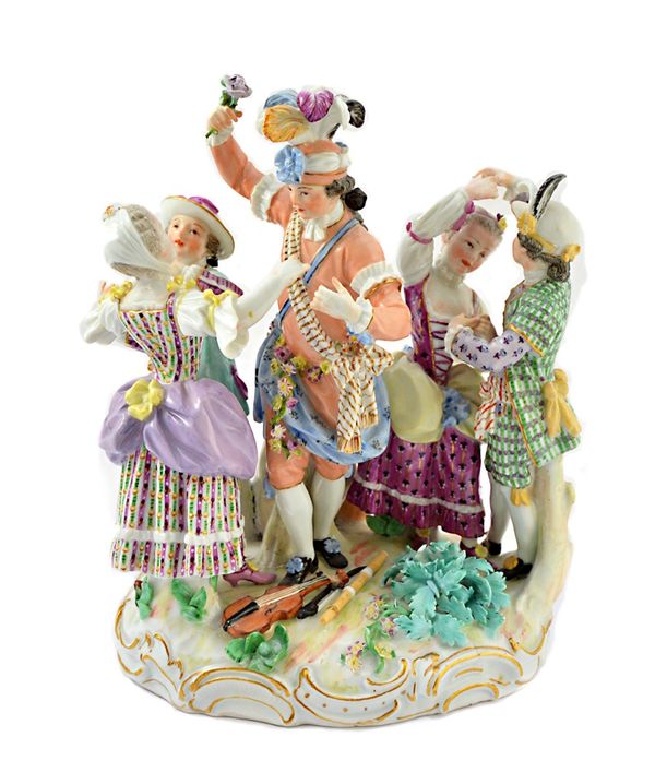 A Meissen porcelain figure group of the town crier dancing, circa 1770 or later, modelled with five people dancing, musical instruments at their feet,
