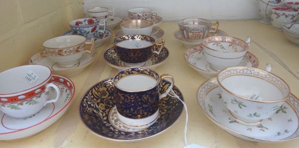 A group of eleven English porcelain cups and saucers, early 19th century, various forms and decoration.