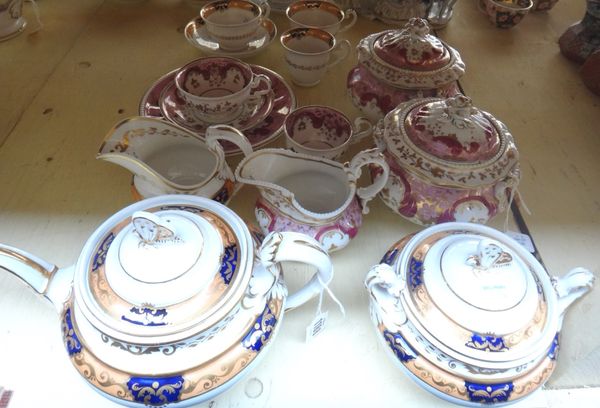 A Ridgway porcelain part tea service, 1820's, with butterfly knops, painted with gilt foliate bands on an apricot and deep blue ground, comprising; te
