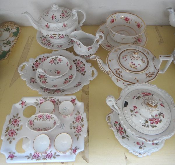 A group of Ridgway porcelains, 19th century, various forms and patterns, painted with pink flowers or roses, comprising; two teapots and covers and a