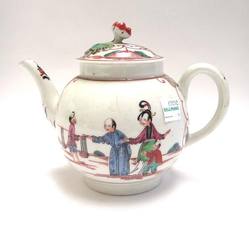 A Worcester polychrome bullet shaped teapot and cover, circa 1770, painted with Oriental figures, the cover with flower knop, 13cm.high.
