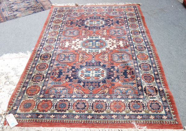 A machine made rug of Caucasian design, 194cm x 137cm, and a fragment of a rug. (2)