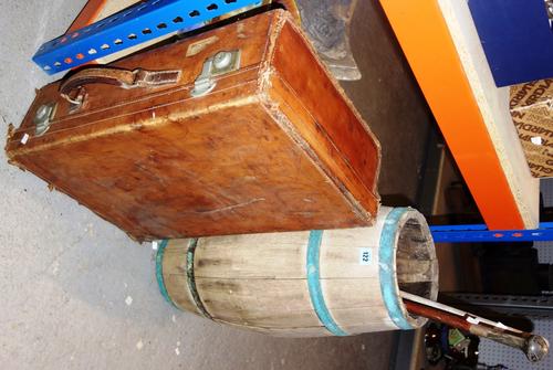 A coopered stick stand, two sticks, and a leather suitcase. (4)