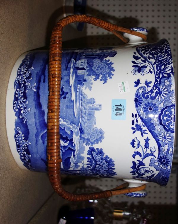 A large blue and white decorated slop bucket.