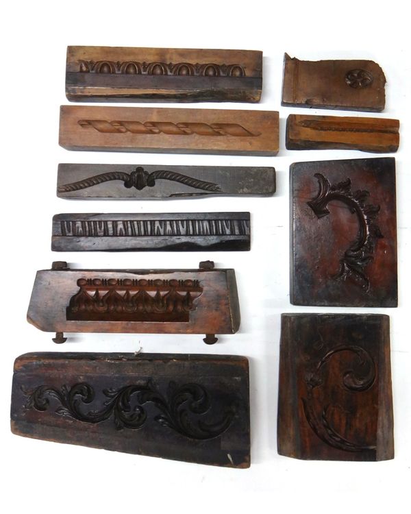 A group of ten 19th century English boxwood framing moulds, including five running pattern moulds, a rope twist crest and four swags/details.(10)