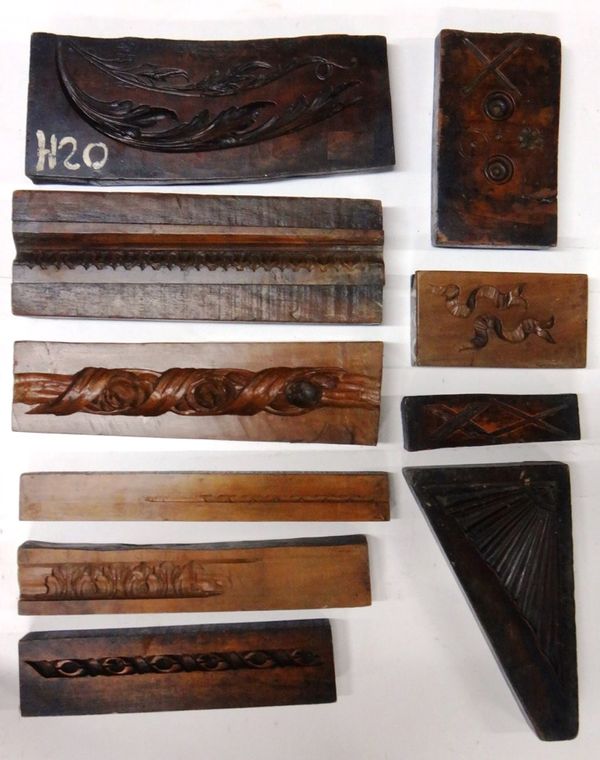 A group of ten 19th century English boxwood framing moulds, including three running pattern moulds, one frieze, a corner section and five swags/detail