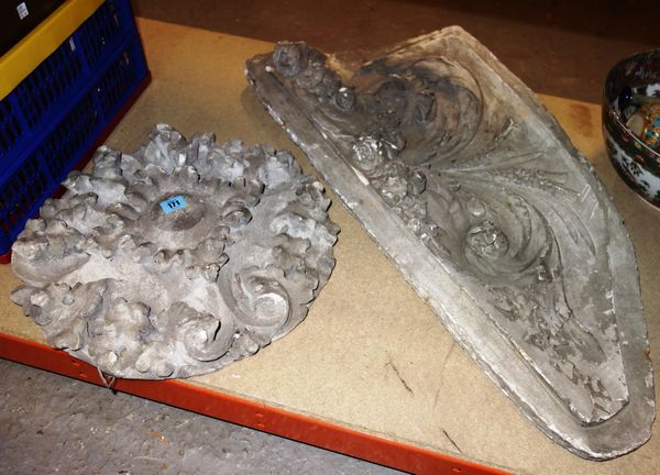 An acanthus moulded plaster roundel, and another moulded plaster section. (2)