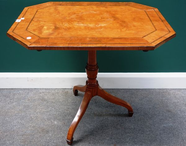 An early 19th century inlaid satinwood occasional table, the compressed octagonal snap top on tripod base, 77cm wide.